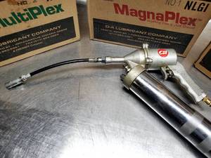 lot 215 image: Grease Gun Air Tool with (4) Cases of Grease Tubes Lot