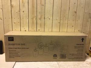 lot 20 image: Pavlen 33 in. 4-Lights Black Vanity Light with Clear Glass Shade by Hampton Bay Customer Returns See Pictures