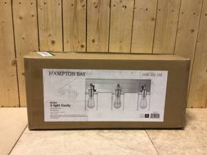 lot 81 image: Regan 21 in. 3-Light Chrome Bathroom Vanity Light with Clear Glass Shades by Hampton Bay Customer Returns See Pictures