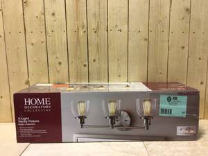 lot 82 image: Evelyn 3-Light 26.75 in. Brushed Nickel Modern Industrial Bathroom Vanity Light by Home Decorators Collection Customer Returns See Pictures