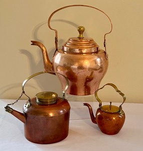 lot 34 image: Three Copper Tea Kettles