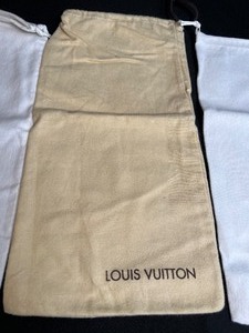 lot 148 image: Prada and Luis Vuitton Shoe Dust Covers