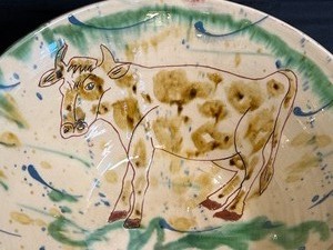 lot 149 image: Lovely Cow Motif Handcrafted Pottery Bowl by Le Tiau