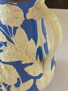 lot 41 image: Large Blue and White Molded Relief Stoneware Pitcher