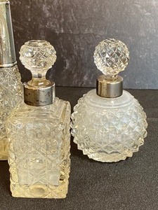 lot 169 image: Three Crystal and Sterling Dabber Bottles