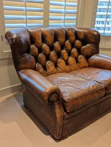 lot 273 image: Distressed Leather Loveseat by Sam Moore