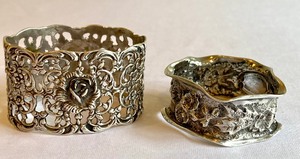 lot 397 image: Two Antique Sterling Napkin Rings