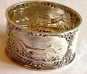 lot 387 image: Adorable Antique Sterling Napkin Ring with Frolicking Dogs