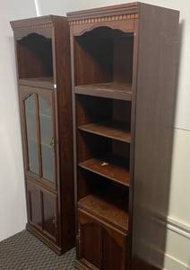 Two Wooden Shelves One With Glass Door