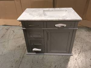 lot 8 image: Sonoma 36 in. W x 22 in. D x 34 in. H Bath Vanity in Pebble Gray with White Carrara Marble Top by Home Decorators Collection Damaged on Bottom See Pictures