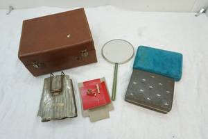 lot 18 image: vintage hand mirror and tie clipslapel pins