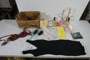 Woven Basket with Assorted Clothing and Beauty Products