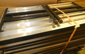 lot 21 image: TWO Nice aluminum tables with laminate top and folding legs - very sturdy - 30x60 x 29-34 tall - good condition