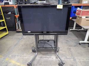 Panasonic TV on roller cart  includes power cable and HDMI cable