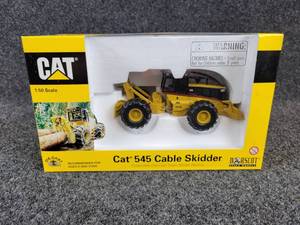 lot 28 image: NORSCOT Scale Models Caterpillar 545 Cable Skidder - 150 Scale In Original Box - Part No. 55072