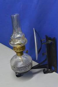 lot 19 image: Oil Lamp with wall swiveling light deflector