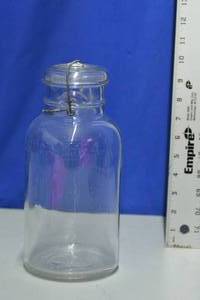 lot 26 image: Cleaveland Fruit Juice Co Glass Jar with Lid