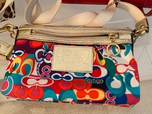 lot 23 image: Three Coach Handbags and a Wristlet