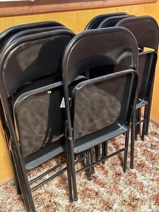 lot 53 image: Seven Black Folding Chairs