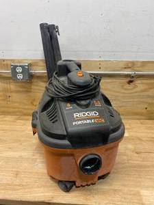 lot 77 image: RIDGID 4 Gallon 5.0-Peak HP Portable WetDry Shop Vacuum