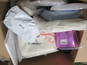 box of pillow covers , adhesive bra...