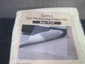 lot 105 image: 6x9 ft Syntus Gripper Rug Pad...