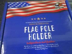 lot 124 image: Lion Stainless Steel Flag Pole Hold...