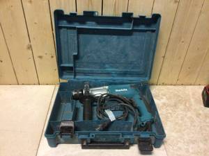6.6 Amp 34 in. Corded Hammer Drill with Torque Limiter Side Handle Depth Gauge Chuck Key Hard Case by Makita Customer Returns See Pictures
