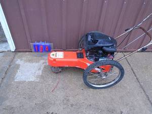 Wheeled weed trimmer. 4 cycle engine. Consignor states it runs as it should. As shown.