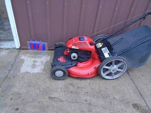 Big wheel self propelled lawn mower with bagger. Briggs & Stratton engine. Tested & works. As shown.
