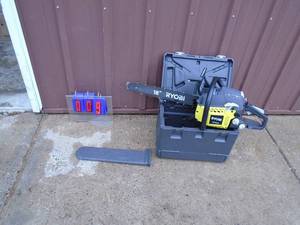 Ryobi 2 cycle 18 chainsaw with case. Looks lightly used. Tested & works. As shown.