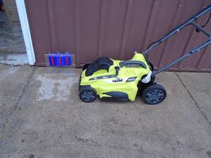 Ryobi 110 volt push mower. Looks lightly used. Tested & works. As shown.