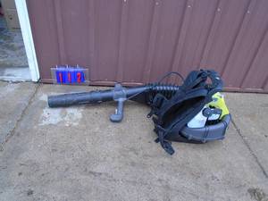 Ryobi back pack blower. Looks lightly used. Tested & works. As shown.