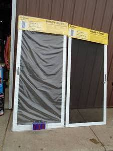 Qty of 2 36 x 80 sliding screen doors. As shown.