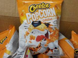 lot 282 image: Case of Cheetos Popcorn Cheddar pa...