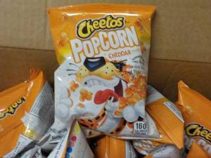 lot 284 image: Case of Cheetos Popcorn Cheddar pa...