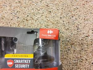 lot 76 image: kwikset front door lock set, open box