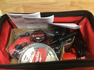 lot 90 image: Milwaukee M18 18-Volt Lithium-Ion Brushless Cordless Hammer Drill and Circular Saw Combo Kit Battery and charger open box customer return