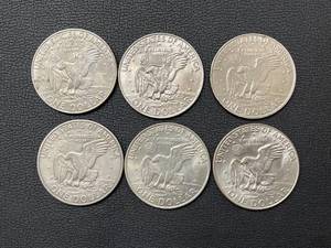 lot 10 image: 6 Ike Dollar Coins