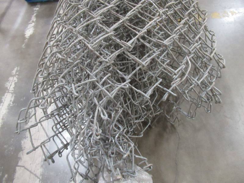 lot 35 image: Cut Piece of Chain-link fencing used in warehouse. Approximately 10 x 12