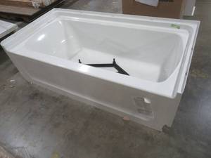 lot 484 image: Sterling 60 x 30 Right-Hand Drain Rectangular Alcove Bathtub in White - Cracked RH front Bottom Corner of Apron.