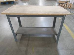 lot 498 image: Edsal 34 in. H x 48 in. W x 24 in. D Wooden Top Workbench with Shelf - Used in Warehouse.