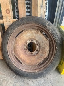 lot 3 image: old cultivator wheel & tire ford  probably collective 