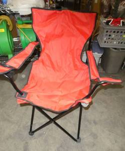 Red camp chair and duffel bag on wheels
