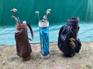 Golf bags with clubs