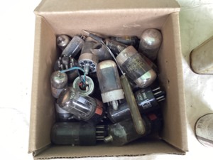 Antique metal shop cans, AC delve computer, box of TV tubes, 4 flood lights