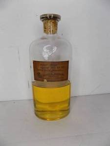 lot 10 image: Vintage Bottle Caster Oil