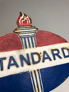 lot 208 image: Embossed Cast Iron STANDARD Oil Plaque Sign