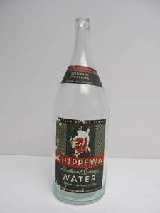 lot 224 image: Large 14 Chippewa Water Glass Advertising Bottle wPaper Label.