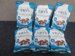 lot 92 image: 6- 3.5 oz Bags Lils Milk Chocolate...
